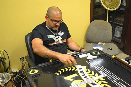 Erik Espinosa competing at the domino table