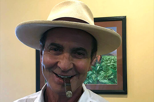 Litto Gomez enjoying a cigar at Cordova Cigars
